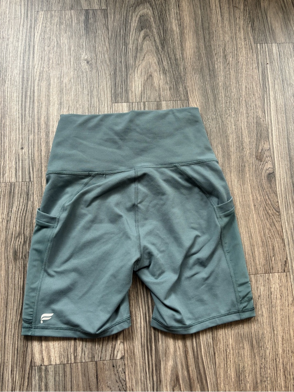 Fabletics Sage Green High-Rise Bike Shorts with Side Pockets